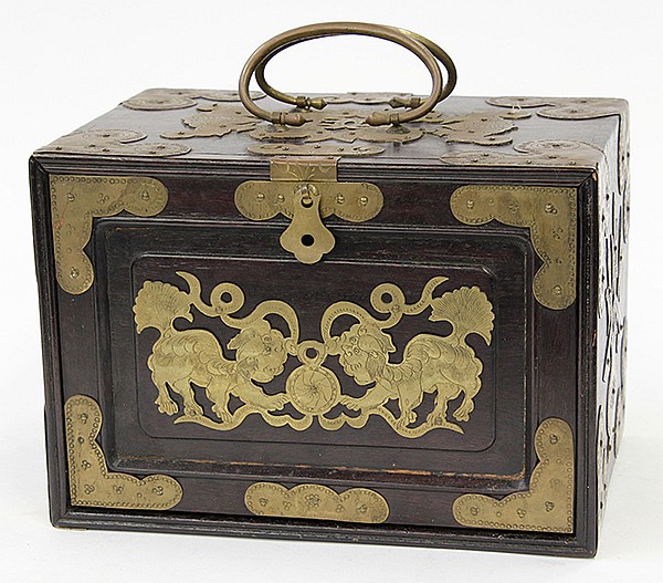 Note the stylized lions on the front of this beautiful wood box with brass trimming